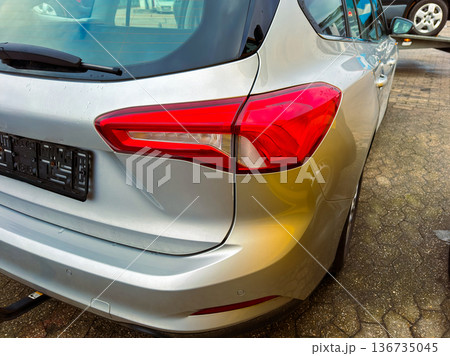 Car parked in a lot during daylight hours with a focus on the rear design and tail light features of the vehicle Car parked in a lot during daylight hours with a focus on the rear design and tail light features of the vehicle 136735045