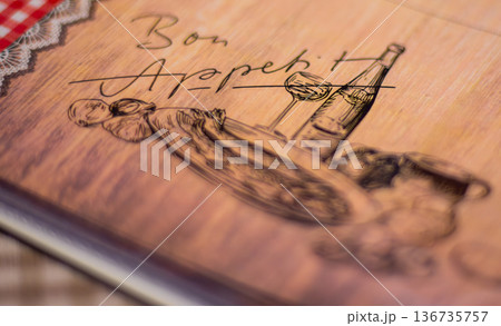 Rustic wooden menu cover with vintage food and wine sketch with Bon Appetit text 136735757