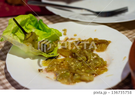 Chopped green peppers with lettuce leaf 136735758