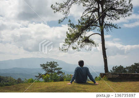 sunrise with man see moving of cloud and clear sky and layer of mountain sunrise with man see moving of cloud and clear sky and layer of mountain 136735897