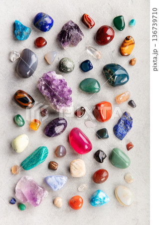 Assorted Healing Crystals and Gemstones on Stone Surface Assorted Healing Crystals and Gemstones on Stone Surface 136739710