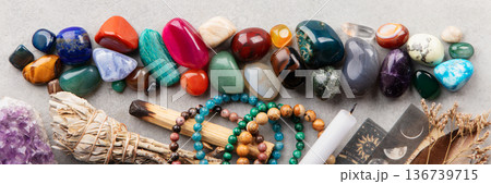 Healing Crystals, Tarot Cards, and Candle on Spiritual Altar 136739715