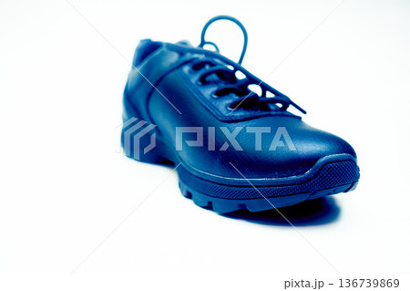 One lonely winter leather warm boot in blue light One lonely winter leather warm boot in blue light 136739869