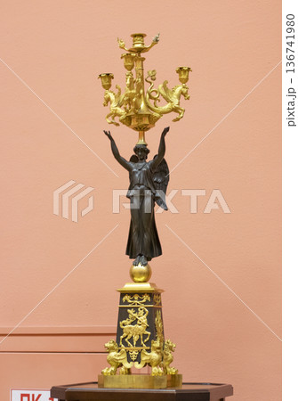 02.02.2026 - Minsk, Belarus -French Empire candelabrum, featuring a bronze figure of a winged Victory holding lighting elements on display of the museum 136741980