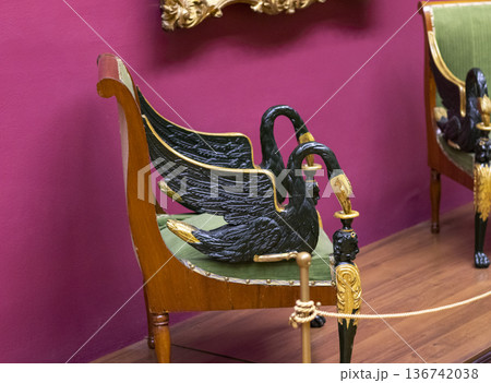 02.02.2026 - Minsk, Belarus - an antique Neoclassical or Empire-style fauteuil chair on display of the museum 02.02.2026 - Minsk, Belarus - an antique Neoclassical or Empire-style fauteuil chair on display of the museum 136742038