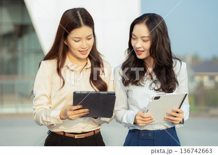 Business team present. professional investor working new start up project. Finance managers meeting.using smart phone and laptop and digital tablet computer. Business team present. professional investor working new start up project. Finance managers meeting.using smart phone and laptop and digital tablet computer. 136742663