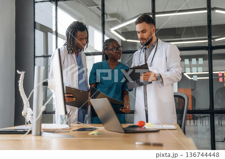 Doctors are working in the office Doctors are working in the office 136744448
