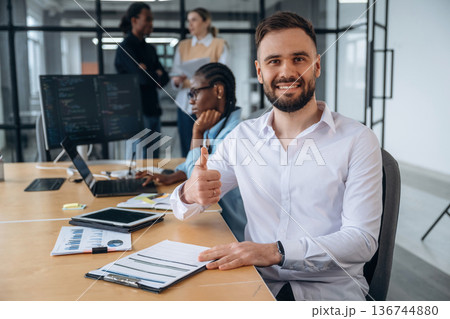 Paperwork on the table. Business people are working in the office Paperwork on the table. Business people are working in the office 136744880
