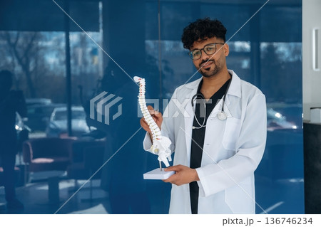 Doctor is indoors in the modern building Doctor is indoors in the modern building 136746234
