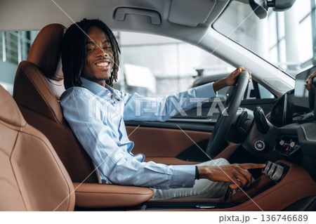 Pushing the button. Man in shirt is in the modern car 136746689