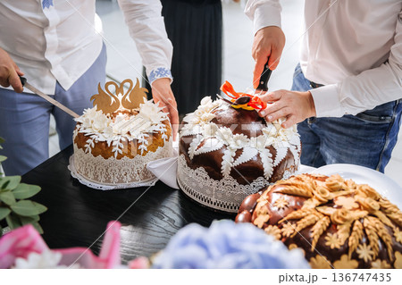 Traditional wedding bread cutting ceremony during festive marriage celebration 136747435