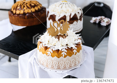 Traditional wedding bread with swan decoration served at marriage celebration Traditional wedding bread with swan decoration served at marriage celebration 136747471