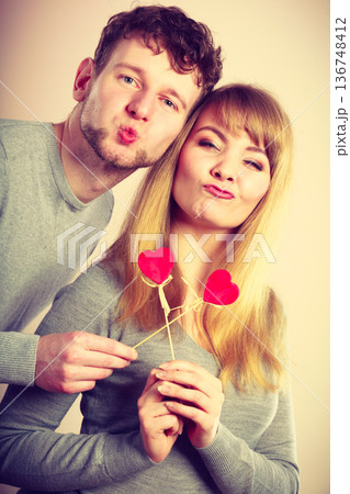 Charming young pare with little hearts. Charming young pare with little hearts. 136748412