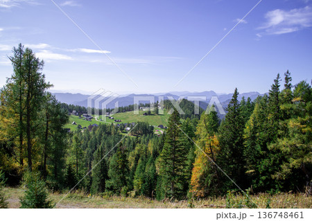View of a mountain valley with a small village from the top of the mountain 136748461