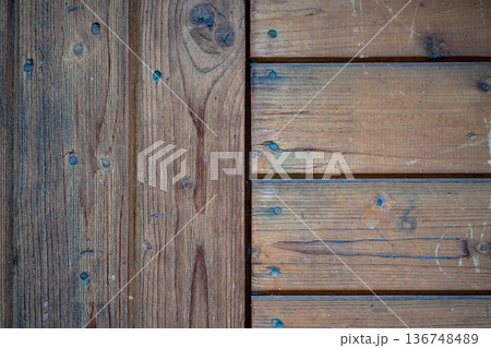 Close-up view of horizontal and vertical wood panel masonry Close-up view of horizontal and vertical wood panel masonry 136748489