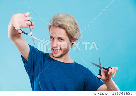 Man with scissors for haircutting 136748659