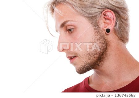 Teen boy with piercing and fashionable hairstyle 136748668
