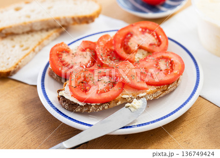 delicious bruschetta with fresh tomatoes on ciabatta slices on a plate 136749424