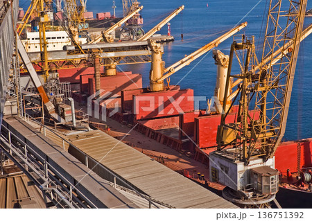 Industrial series of silver grain silos and port terminal logistics. Industrial series of silver grain silos and port terminal logistics. 136751392