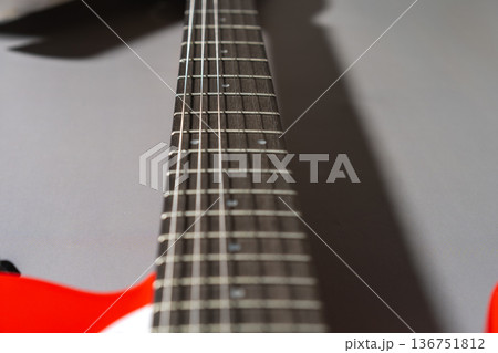 Close-up of an electric guitar neck. Selective focus. Close-up of an electric guitar neck. Selective focus. 136751812