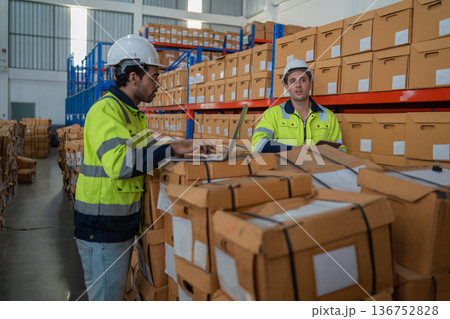 Warehouse worker working in warehouse storage.  136752828
