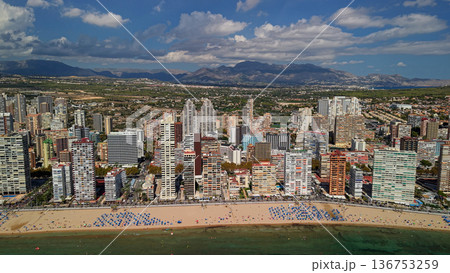 Aerial panoramic view of Benidorm city skyline and sandy beach with Mediterranean coastline Spain 136753259