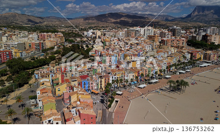 Aerial view of colorful houses and beachfront promenade in Villajoyosa coastal town Spain Mediterranean seaside 136753262