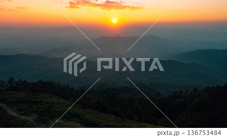 Scenic aerial view of mountain layers during golden sunset Scenic aerial view of mountain layers during golden sunset 136753484