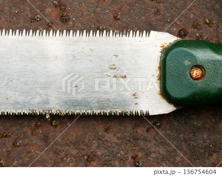 Rusty Japanese Pull Saw on Ground: Old Nokogiri Woodworking Tool Close-up Weathered Concrete Surface Detail Rusty Japanese Pull Saw on Ground: Old Nokogiri Woodworking Tool Close-up Weathered Concrete Surface Detail 136754604
