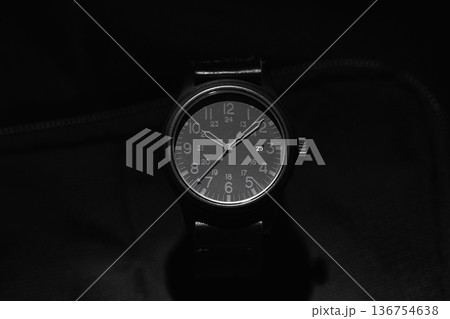Close-up of a black analog wristwatch 136754638