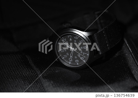 Close-up shot of a black tactical analog wristwatch Close-up shot of a black tactical analog wristwatch 136754639