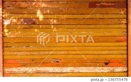Wooden fence made of boards. Wooden fence made of boards. 136755476