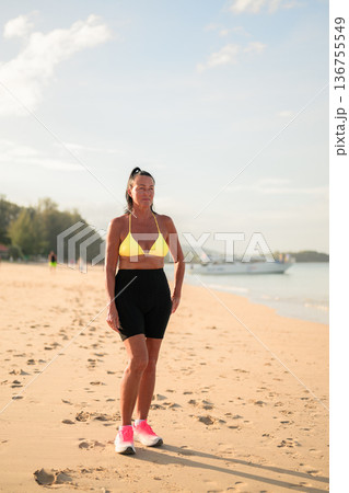 Active Senior Scandinavian Woman in Sportswear and Bikini at Beach in Thailand Island 136755549