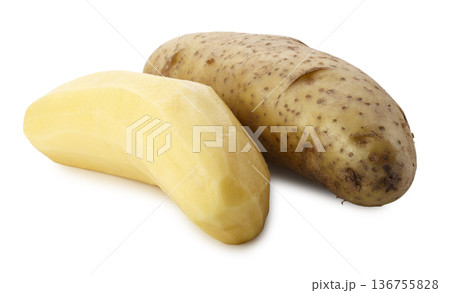Whole raw potatoes and peeled raw potatoes isolated on a white background 136755828