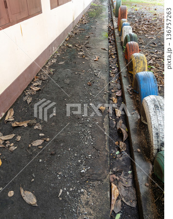Recycled Tire Safety Bumper in School Playground. Recycled Tire Safety Bumper in School Playground. 136757263