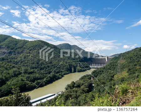 Large Concrete Hydroelectric Dam and High Voltage Lines. 136757264