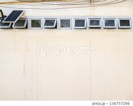 Row of Ventilation Windows on Hospital Building Wall. 136757266