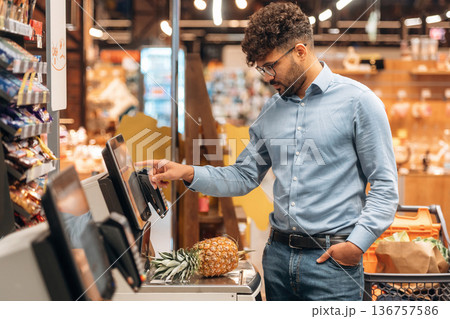 Front view. Man is in the grocery store 136757586