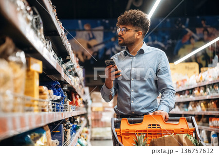 Searching for meal. Man is in the grocery store 136757612