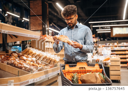 Man is in the grocery store Man is in the grocery store 136757645