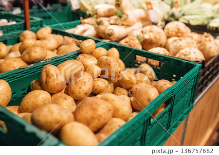 Focused close up view of fresh potato in the grocery store Focused close up view of fresh potato in the grocery store 136757682