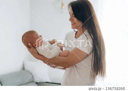 Parenting conception, holding daughter in hands. Woman is with her little toddler baby 136758268