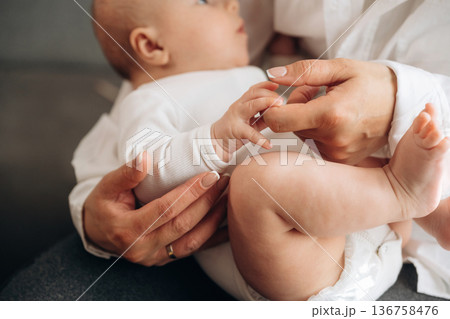 Breast feeding. Woman is with her little toddler baby daughter 136758476