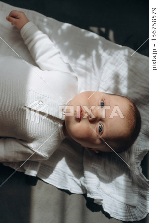 Cute little baby is lying down 136758579
