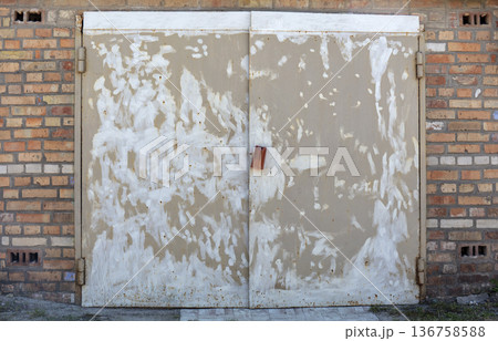 old metal warehouse door, hangar 136758588