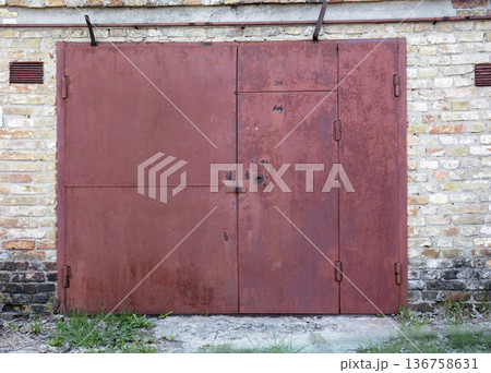 old metal warehouse door, hangar old metal warehouse door, hangar 136758631