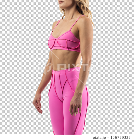 Athletic woman posing in pink sports bra and leggings with transparent background 136759325