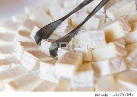 Pieces and cubes of cheese 136759648