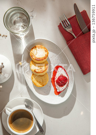 Cheesecakes with berry sauce and sour cream Cheesecakes with berry sauce and sour cream 136759911