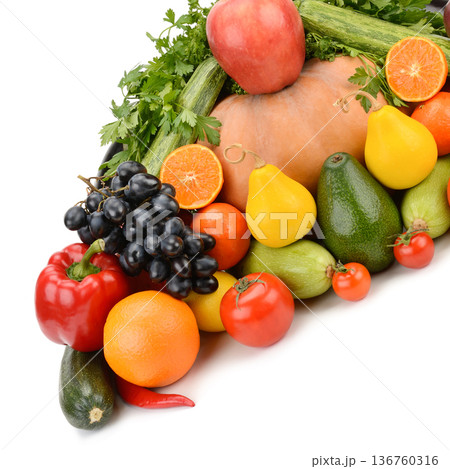 Assortment of fresh organic vegetables and fruits isolated on white Assortment of fresh organic vegetables and fruits isolated on white 136760316